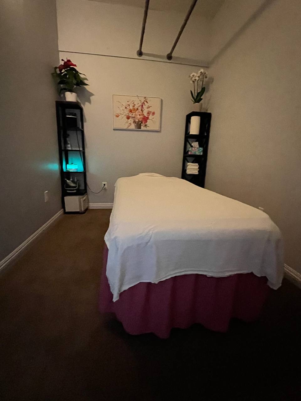 A massage table in the private single treatment room